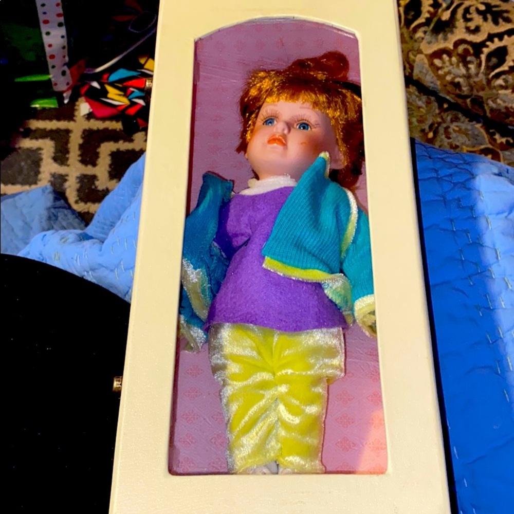 12” porcelain doll with sunglasses on head